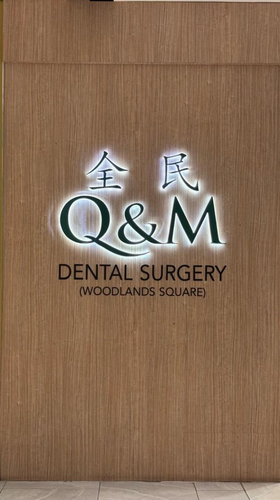 Q&M Dental Surgery backlit lettering